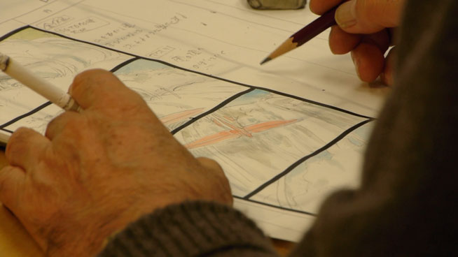 Miyazaki drawing a storyboard for a scene with a plane