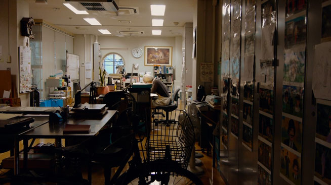 Miyazaki working in an empty office